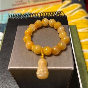 Yellow Beaded Bracelet with Buddha Charm